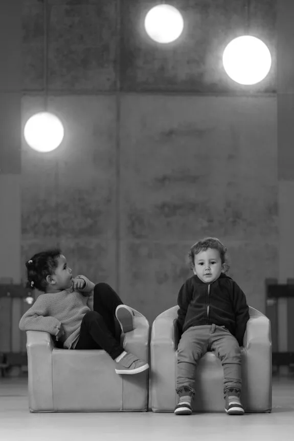 Portrait of adorable babies in the kindergarten. Childhood concept.