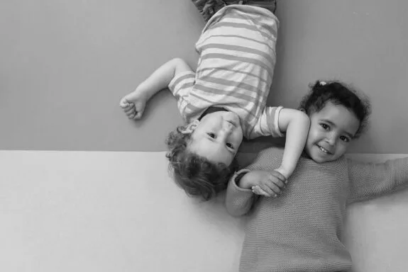 Adorable babies playing together in the kindergarten. Childhood concept